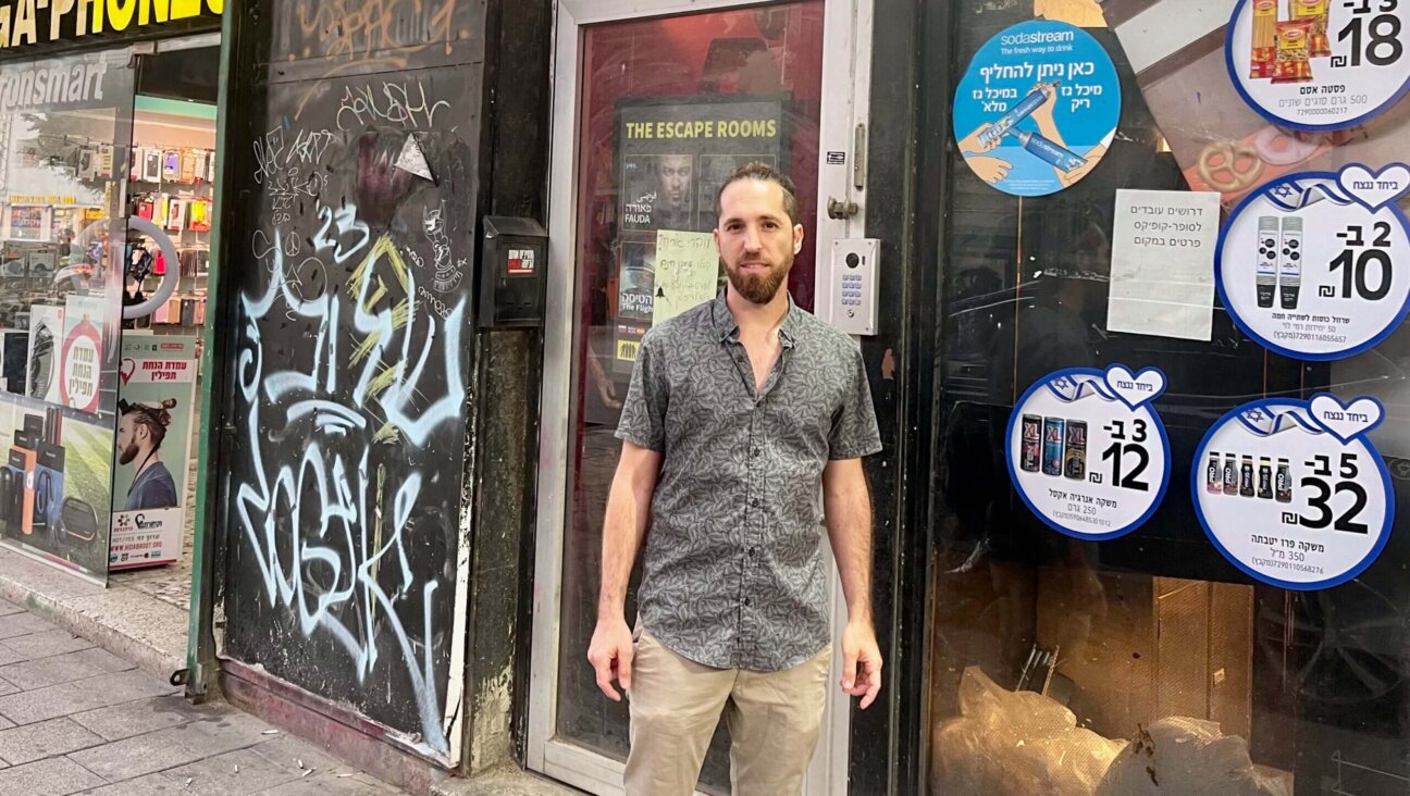 Arik Turkenich outside his Tel Aviv escape room business. He lets all players win because, he said, Israelis "can't afford losing."