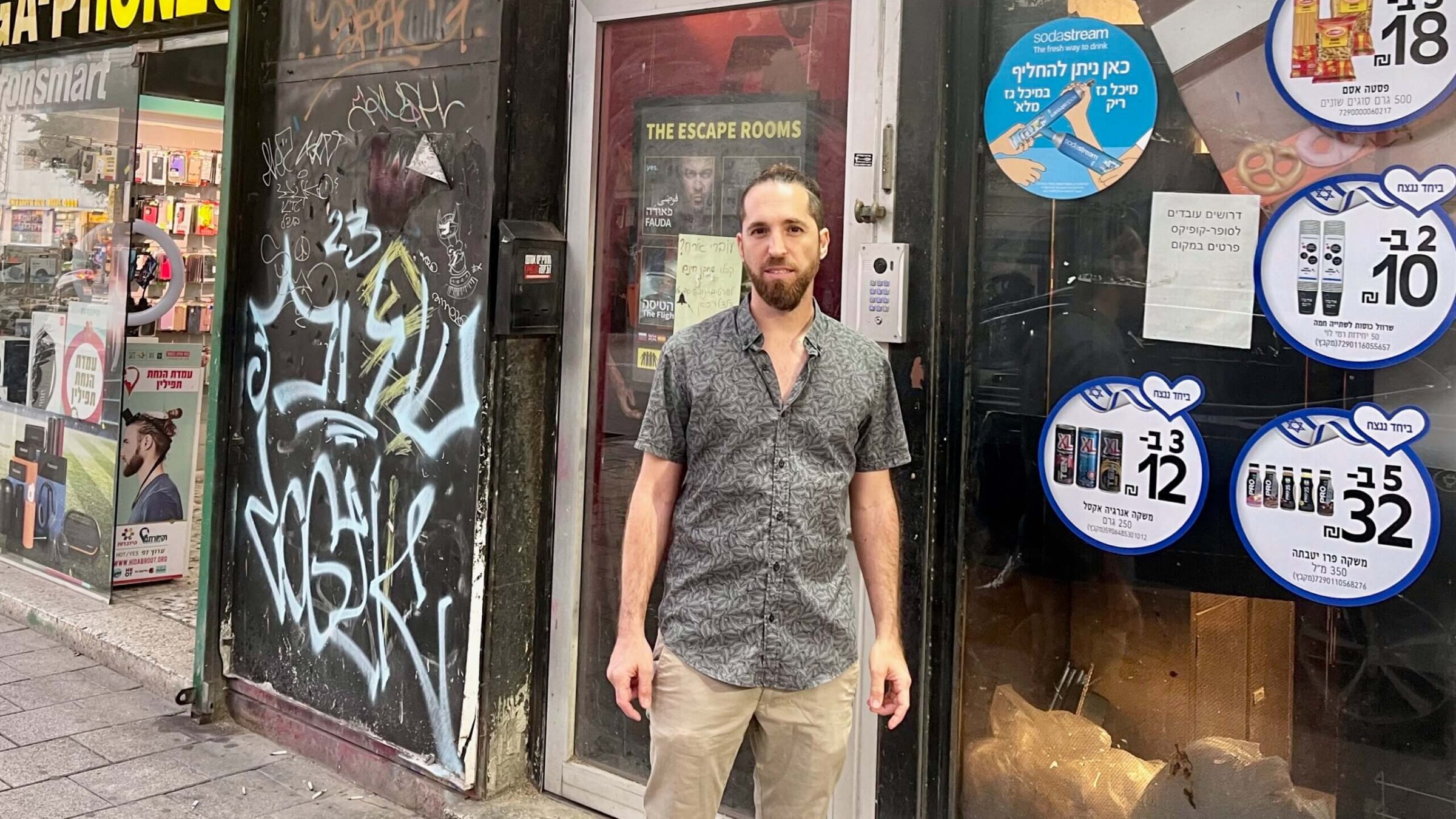 Arik Turkenich outside his Tel Aviv escape room business. He lets all players win because, he said, Israelis "can't afford losing."