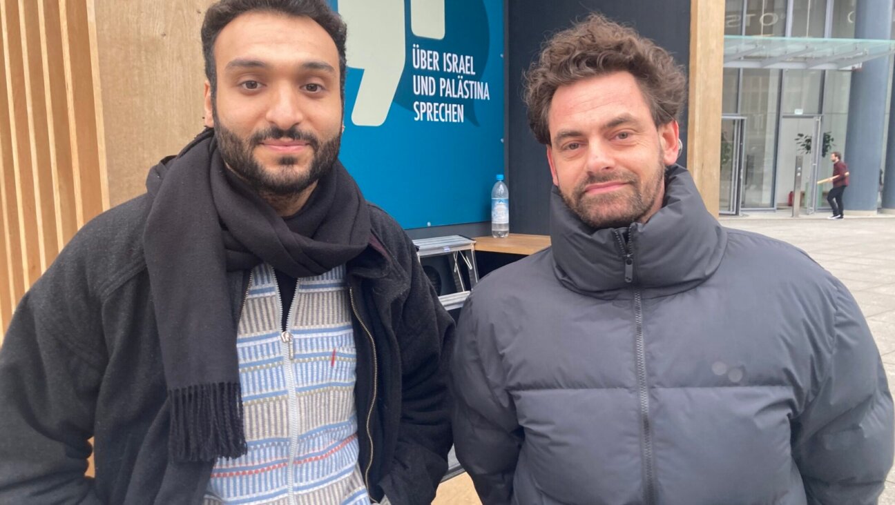 Ahmad Dakhnous, left, and Shai Hoffman together brokered small-group conversations about the Israel-Hamas war outside the Berlinale film festival in Berlin, Feb. 18, 2024. (Toby Axelrod)
