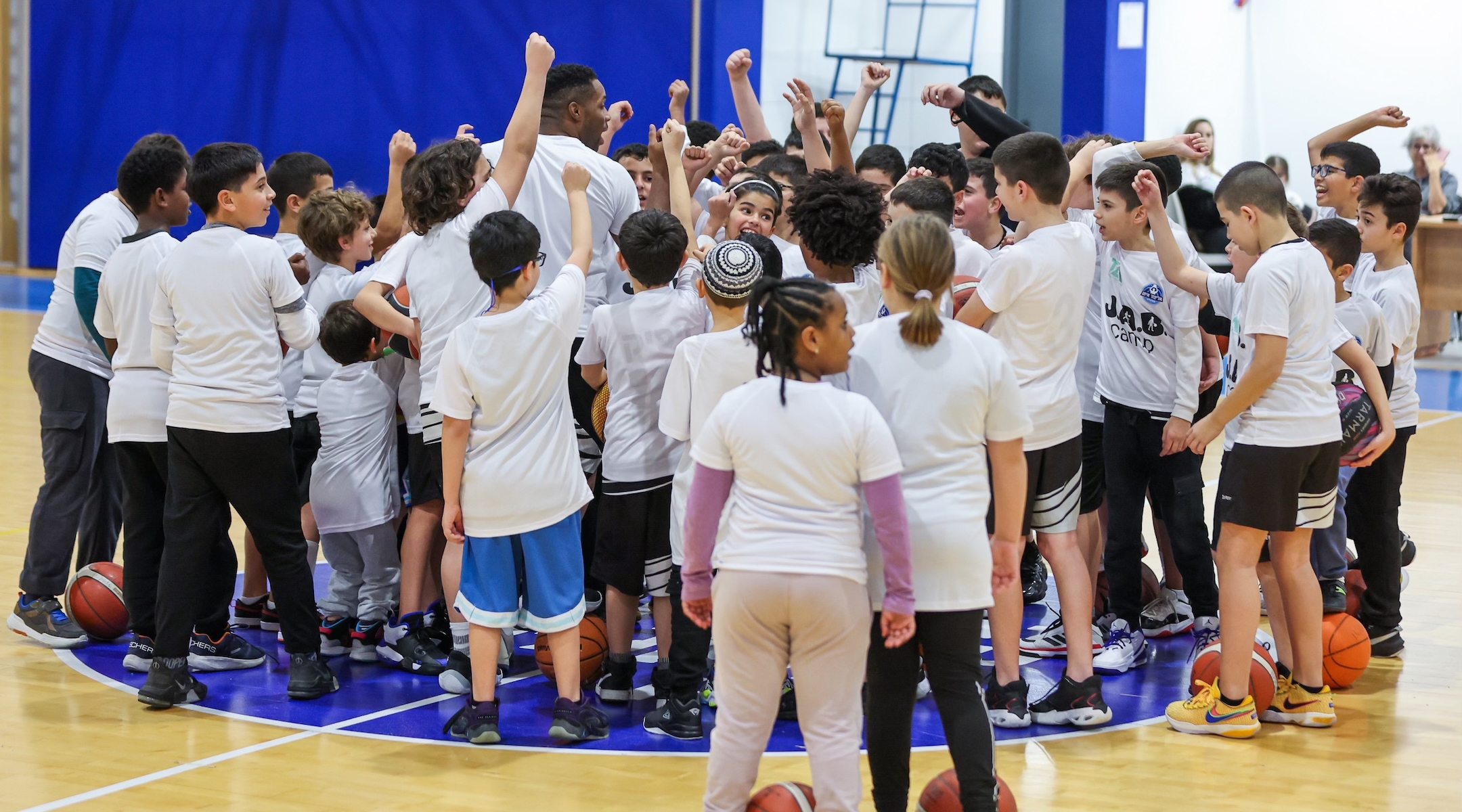 Jared Armstrong, center, is running free basketball clinics for children in Ashkelon, Israel. (Courtesy of Armstrong)
