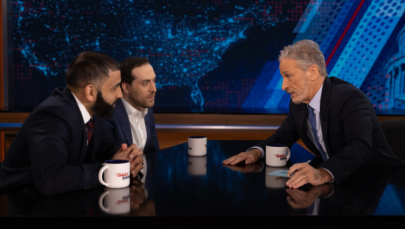 Jon Stewart interviews journalists and friends Yair Rosenberg and Murtaza Hussain.