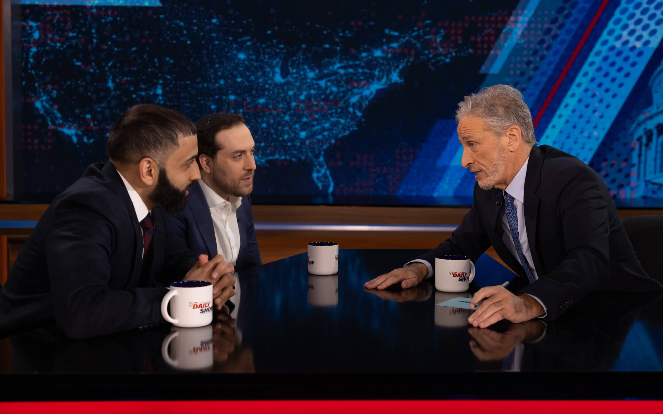 Jon Stewart interviews journalists and friends Yair Rosenberg and Murtaza Hussain.