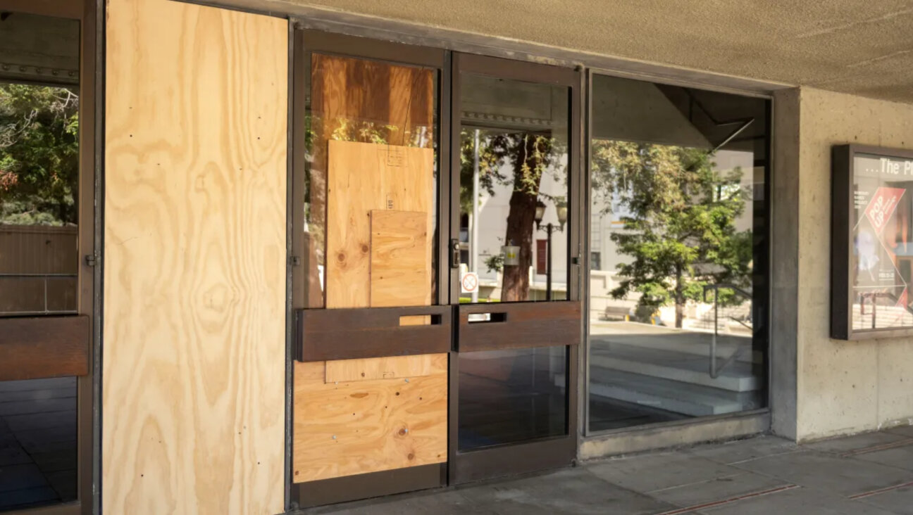 Plywood covers a door and window at Zellerbach Playhouse on the UC Berkeley campus on Tuesday following a raucous  protest by pro-Palestinian protesters the previous night. 
