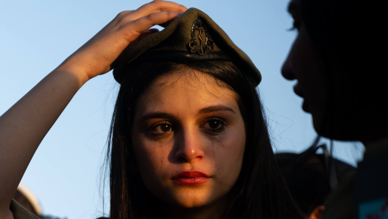 A young woman grieves for Staff Sergeant Shai Arus during his funeral at the Holon Military Cemetery, Nov. 02, 2023 in Holon, Israel. Arus is one of 232 Israeli soldiers who have been killed in Gaza during the four months of ground operations.