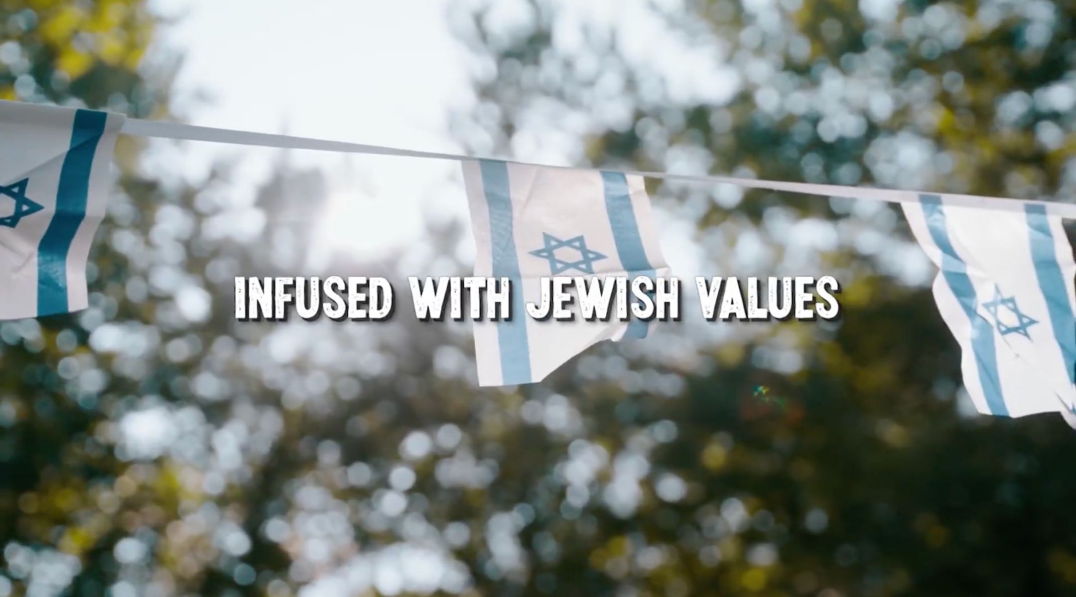 Camp Twelve Trails features Israeli flags in its promotional video. (Screenshot)