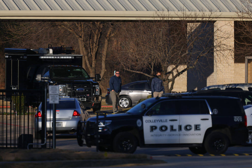A police car outside Congregation Beth Israel Synagogue in Colleyville, Texas, in 2022, after four people taken hostage by a gunman escaped. The rabbi cited training by the Secure Community Network. 