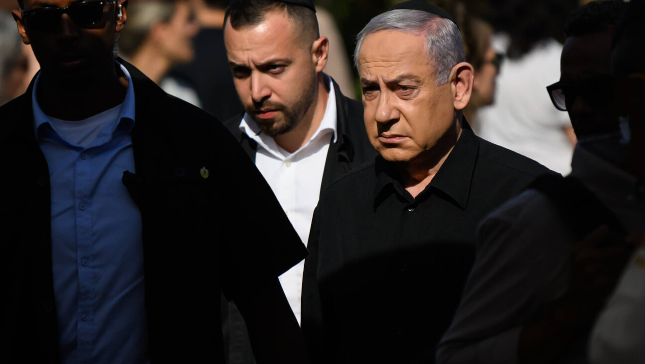 Israeli Prime Minister Benjamin Netanyahu attends the funeral of First Sergeant Major Gal Meir Eisenkot, killed in combat in Gaza, on Dec. 8.