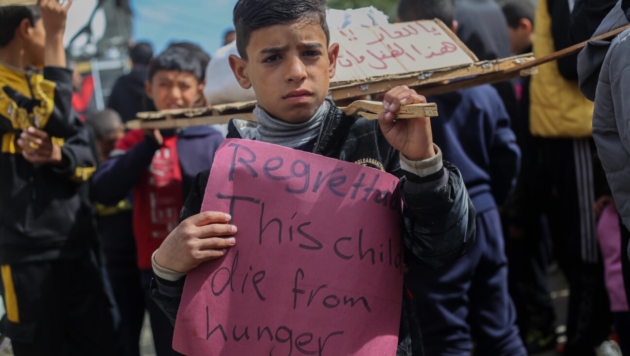 A Palestinian child at a march demanding an end to the war on March 6 in Rafah, Gaza.
