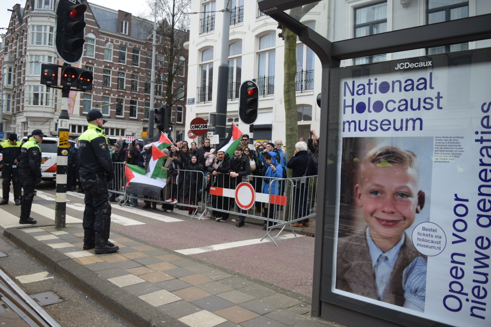Pro-Palestinian protesters hold flags during a rally outside the opening of the National Holocaust Museum in Amsterdam, Netherlands, on March 10, 2024. (Mouneb Taim/Anadolu via Getty Images)