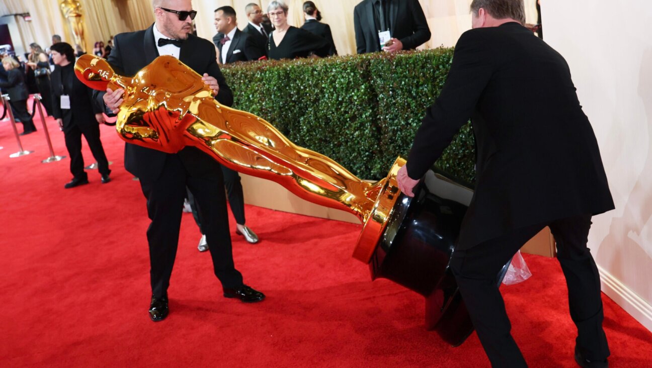 Stagehands carry The Academy Award of Merit statue onto the red carpet at the 96th Annual Academy Awards in the Dolby Theatre in Hollywood, California, March 10, 2024. (Robert Gauthier / Los Angeles Times via Getty Images)