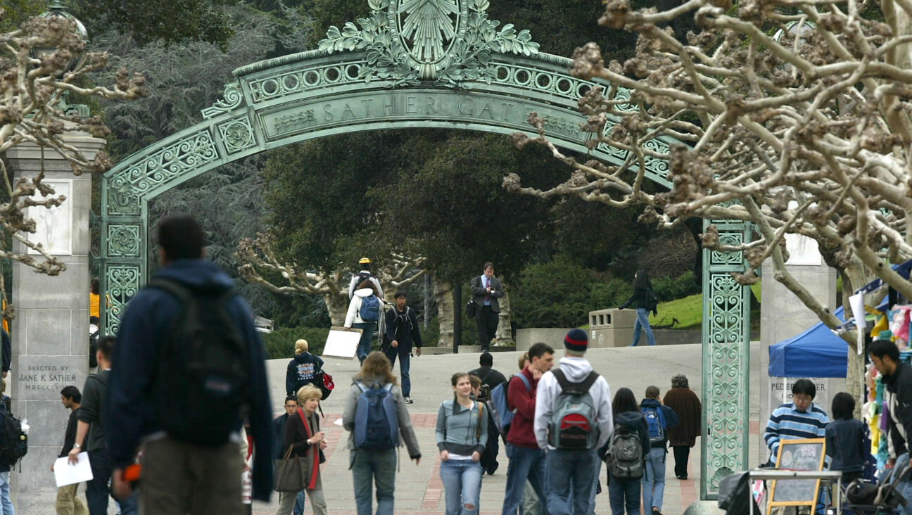 Students walk near Sather Gate on the University of California campus.