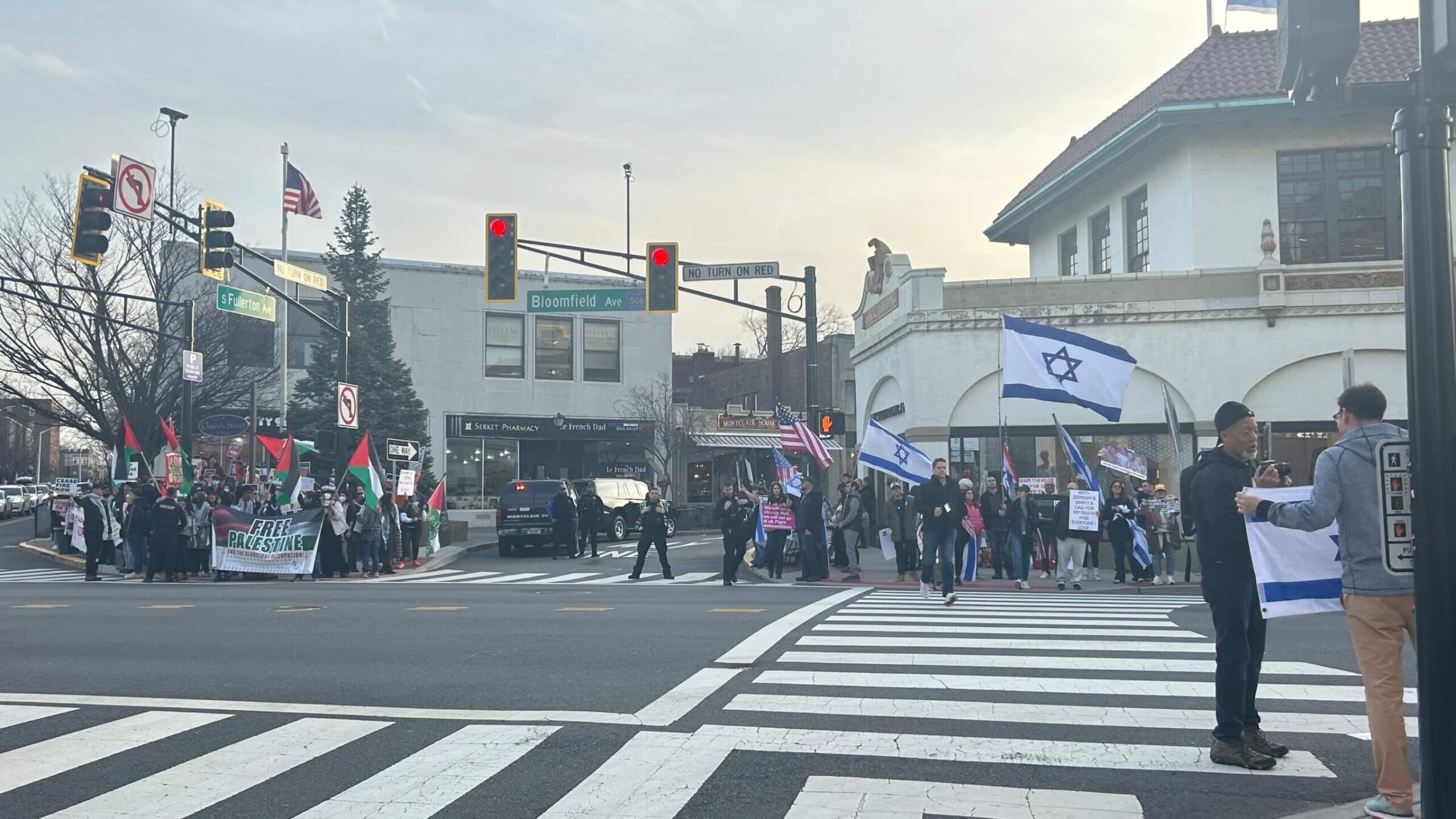 With police forces in between, pro-Palestinian and pro-Israeli protesters stand across the street from one another in Montclair, New Jersey.