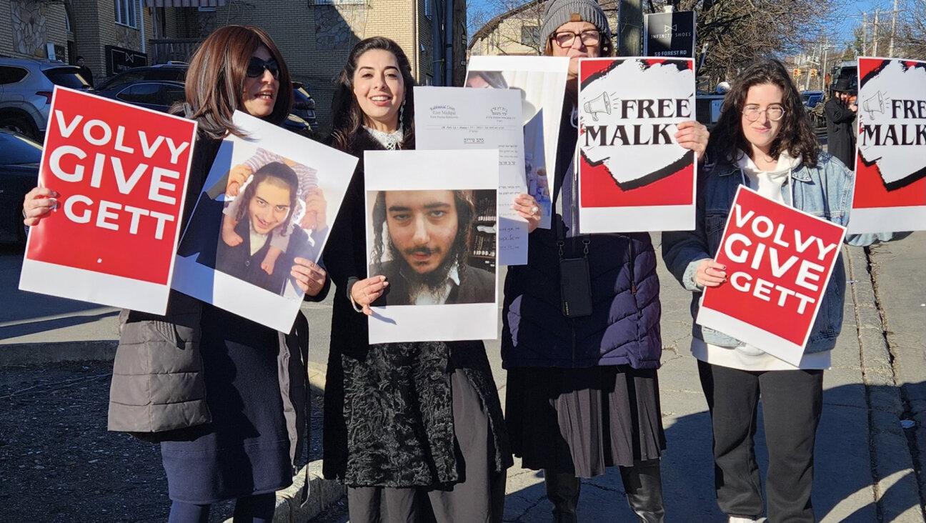 Adina Sash, <i>second from left</i>, at a protest calling on Volvy Berkowitz to give his wife, Malky, a Jewish divorce.