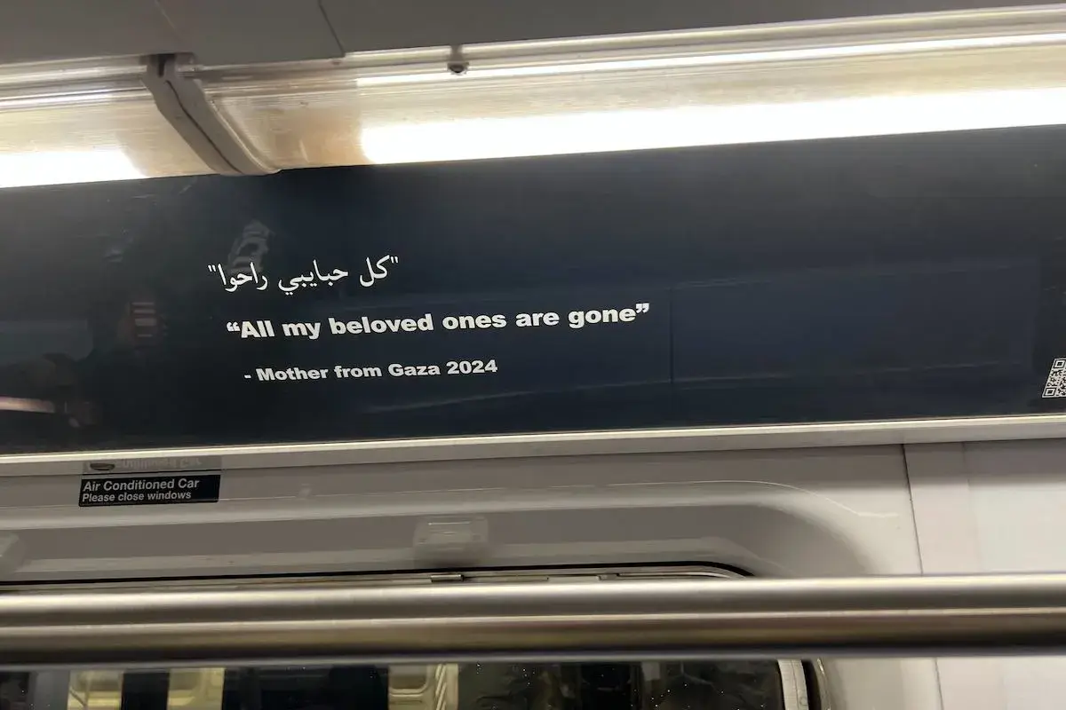 Artists protesting the war in Gaza replaced ads on a New York City subway train with posters like this.