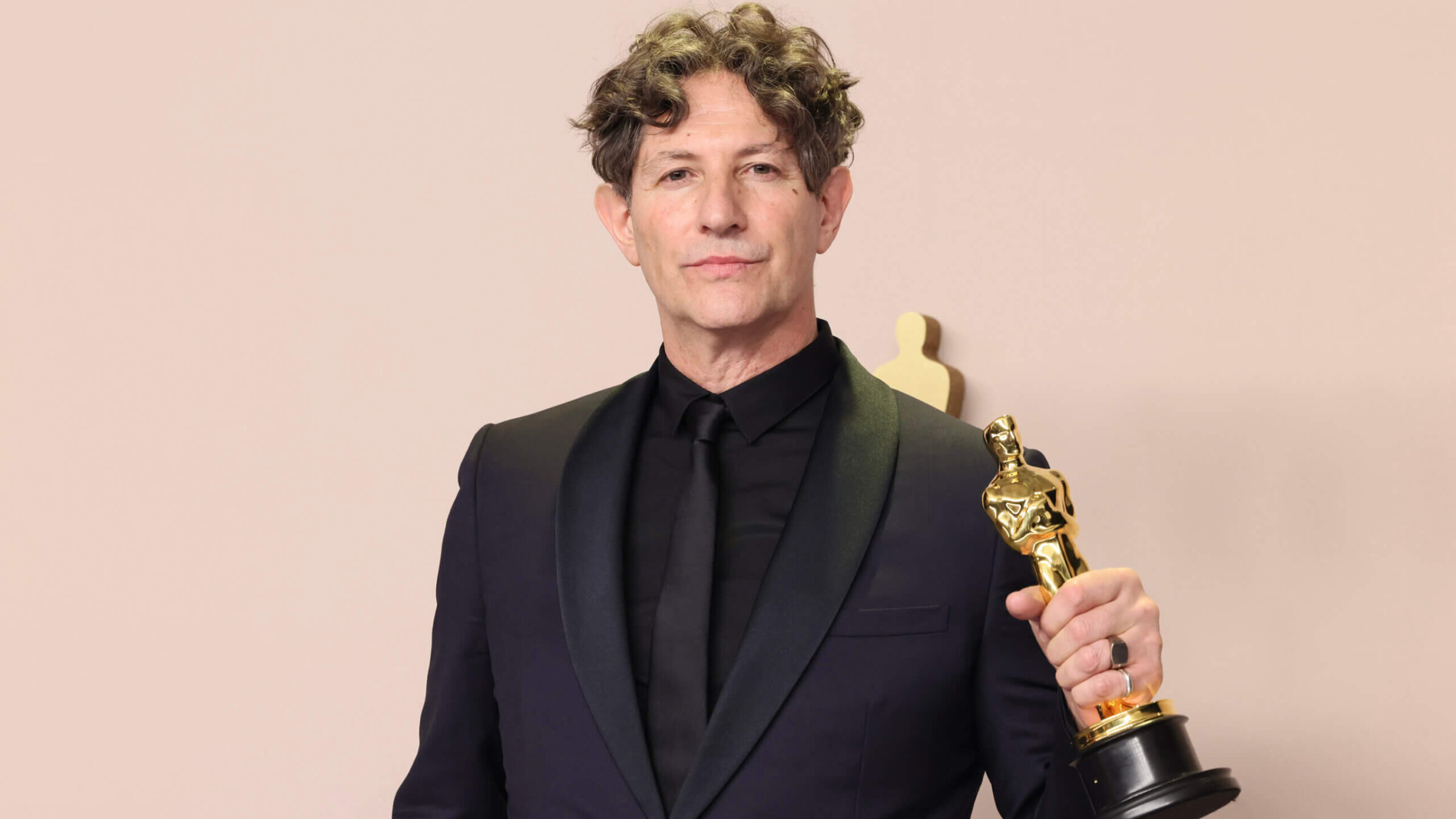Jonathan Glazer, winner of the best international feature film award for <i>The Zone of Interest</i>, poses in the press room during the 96th Annual Academy Awards. 