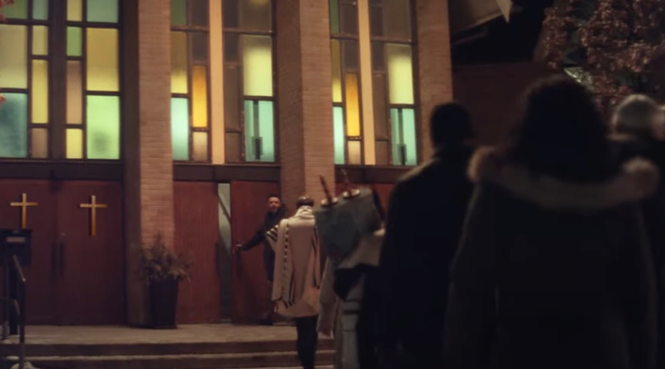 The “Neighbors” ad depicts a church welcoming in a nearby synagogue after a bar mitzvah service was interrupted by a bomb threat. (Screenshot from YouTube)