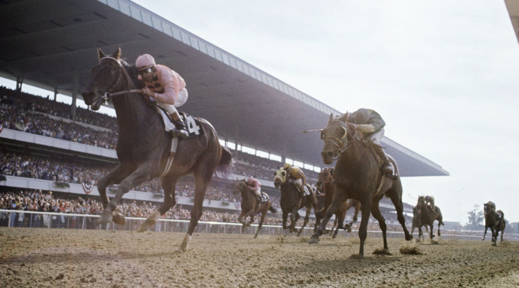 Jockey Walter Blum, left, and his horse, Pass Catcher, in the lead at the 1971 Belmont Stakes. (Getty)