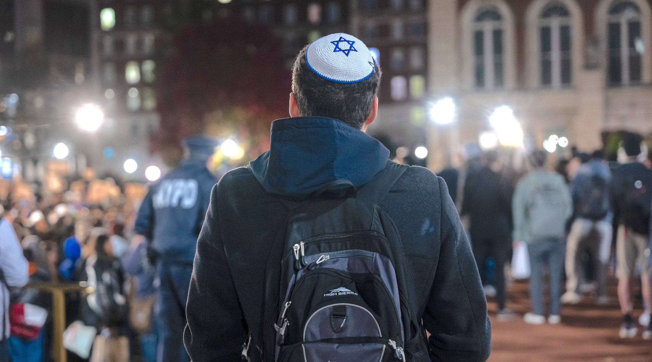 A Jewish student watches a protest in support of Palestinians and for free speech at New York’s Columbia University campus, Nov. 14, 2023. (Spencer Platt/Getty Images)
