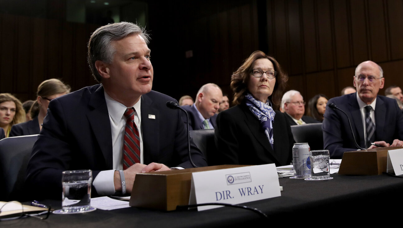 From left: FBI Director Christopher Wray; CIA Director Gina Haspel; Director of National Intelligence Dan Coats. They testified at an annual Senate Intelligence Committee hearing on “Worldwide Threats,” Jan. 29, 2019. (Win McNamee/Getty Images)