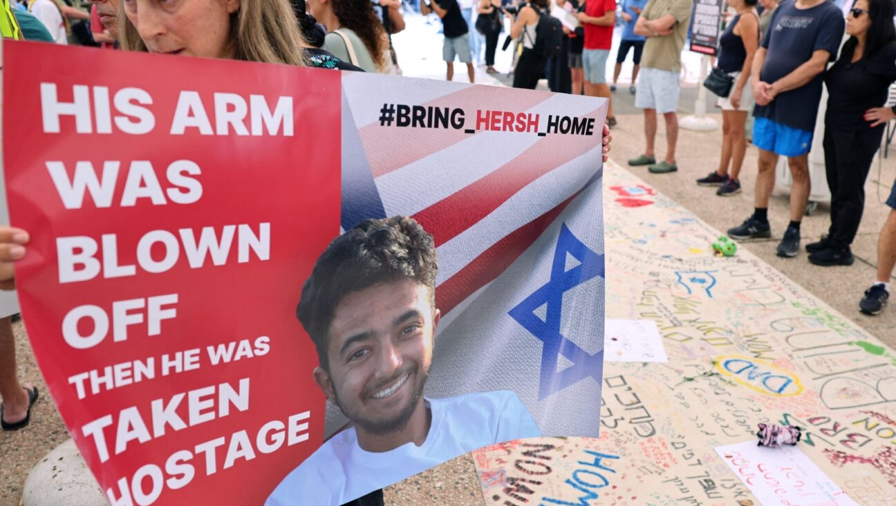 A protester holds a poster with a photo of 23-year-old U.S.-Israeli Hersh Goldberg-Polin as people gather with signs calling for the release of hostages held by Hamas since Oct. 7, during a rally in Tel Aviv Oct. 28.