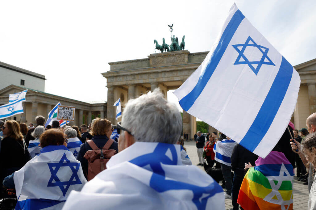 People gather in front of the Brandenburg gate in Berlin on April 14, 2024 in solidarity with Israel after Iran's strikes on Israel from late April 13, 2024.