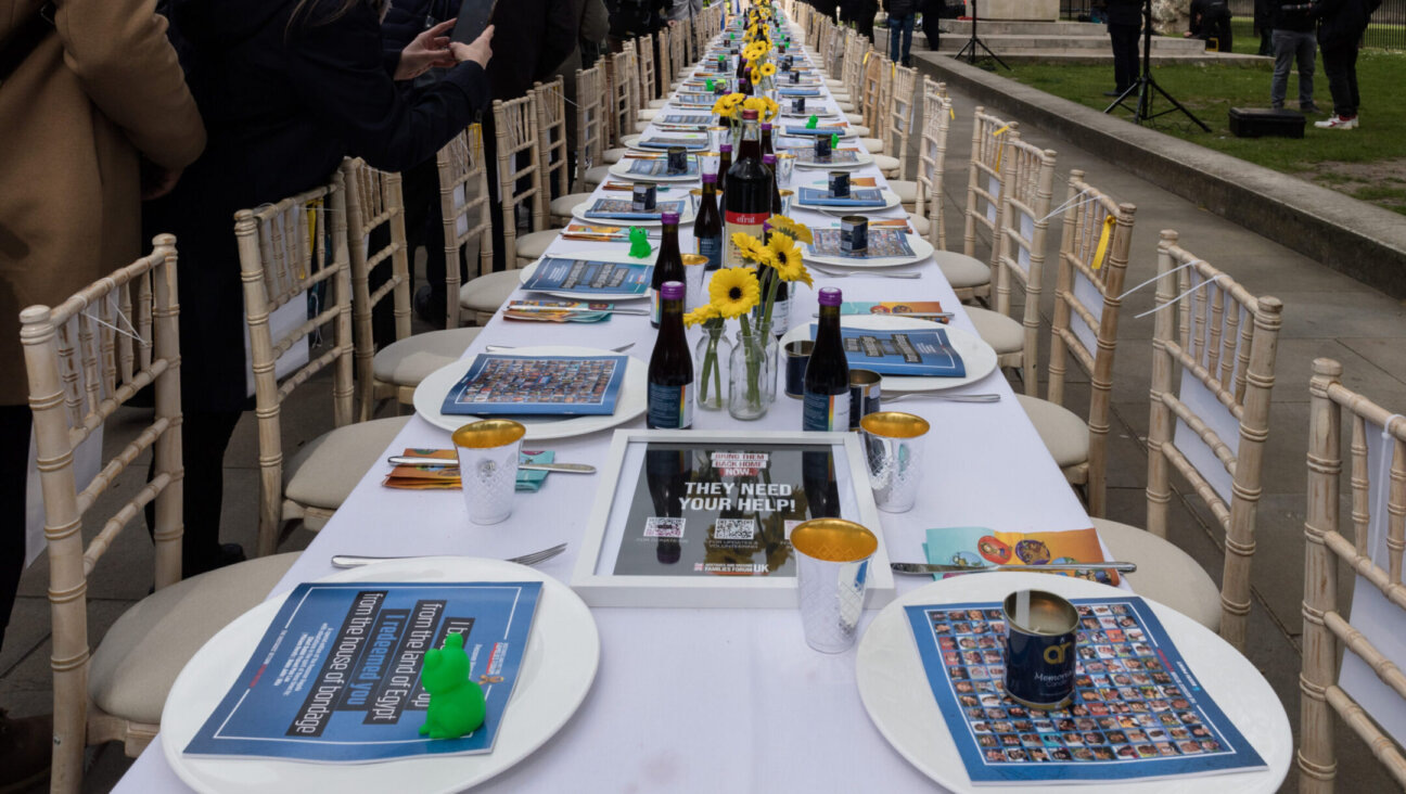 A Passover Seder installation comprising of 133 empty chairs and posters of the Israeli hostages who remain captive in Gaza over six months from the Hamas attack is unveiled outside Downing Street in London, United Kingdom on April 17, 2024. (Wiktor Szymanowicz/Future Publishing via Getty Images)