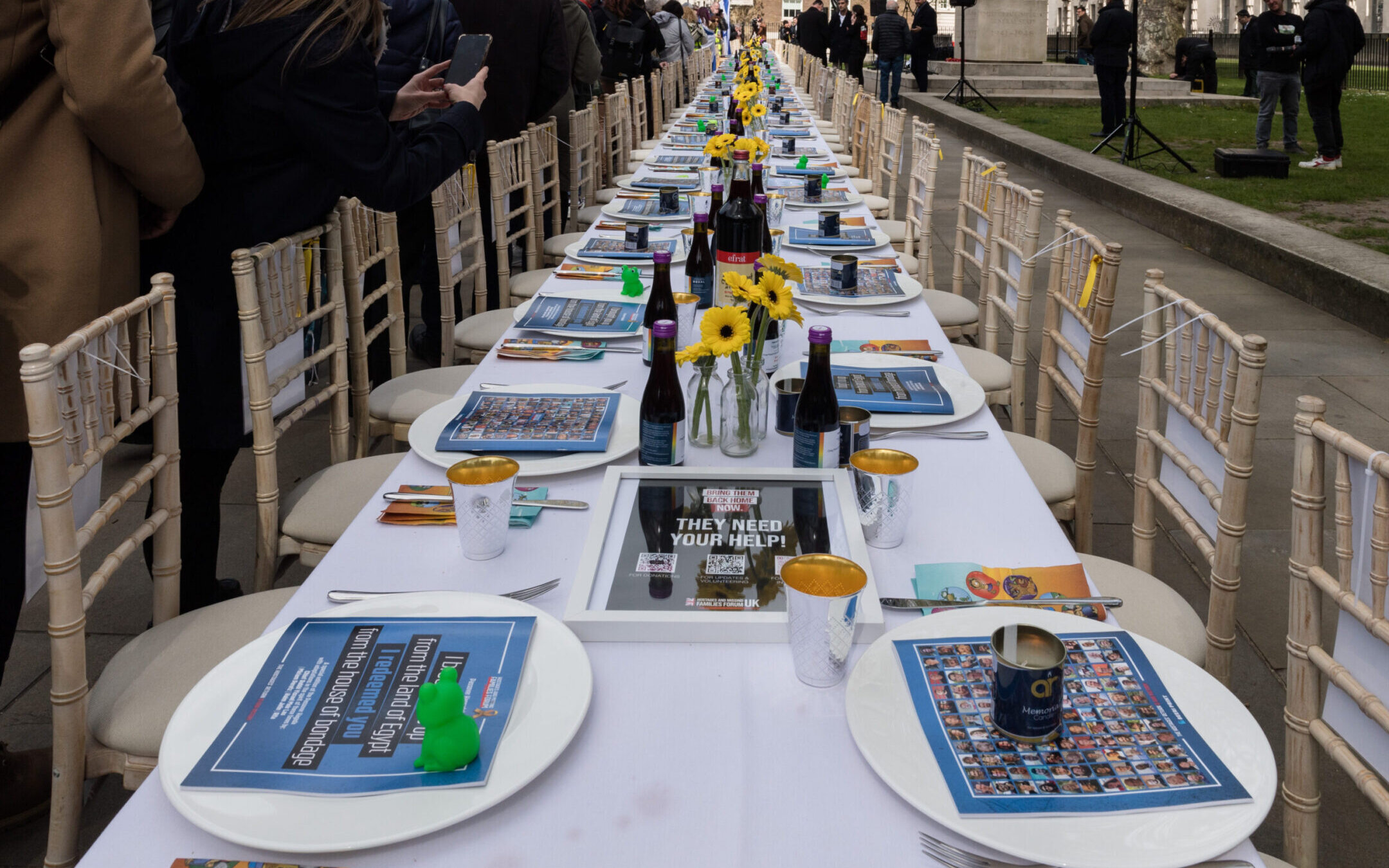 A Passover Seder installation comprising of 133 empty chairs and posters of the Israeli hostages who remain captive in Gaza over six months from the Hamas attack is unveiled outside Downing Street in London, United Kingdom on April 17, 2024. (Wiktor Szymanowicz/Future Publishing via Getty Images)
