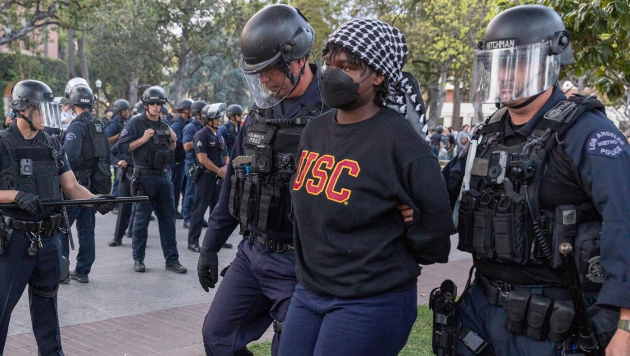 Police officers arrest a pro-Palestinian student protester at the University of Southern California in Los Angeles, California, United States on April 24, 2024. (Grace Hie Yoon/Anadolu via Getty Images)