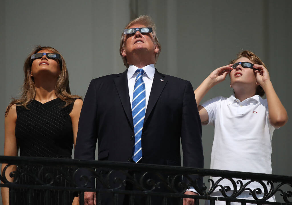 First Lady Melania Trump, President Donald Trump and their son, Barron Trump watch the 2017 eclipse at the White House.