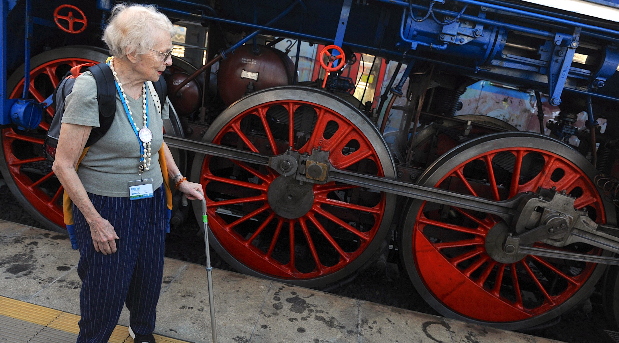 Survivor Hanna Slome looks at a historical train in Prague named ”Winton” after the British stockbroker who helped save her and 668 other children during the Holocaust on Sept. 1, 1999. (AFP Phto/Michal Cozen via Getty Images)