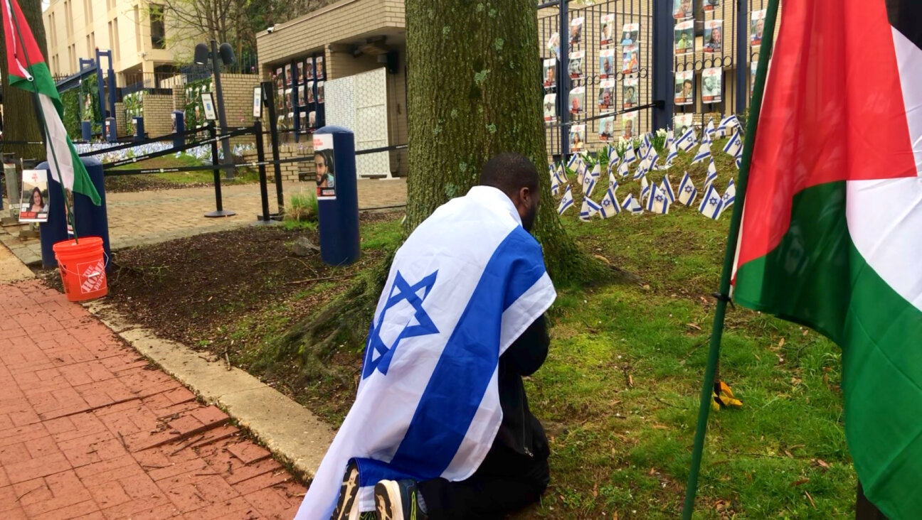 Israel Nehemiah Musonda, a Pentacostal Christian, prays at the Embassy of Israel in Washington, D.C., on April 2, 2024.