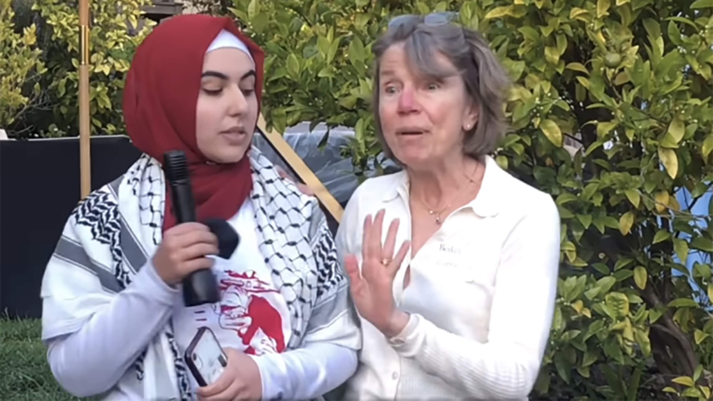 UC Berkeley law professor Catherine Fisk attempts to get law student Malak Afaneh to leave the home Fisk shares with her husband, Berkeley law Dean Erwin Chemerinsky, April 9, 2024.