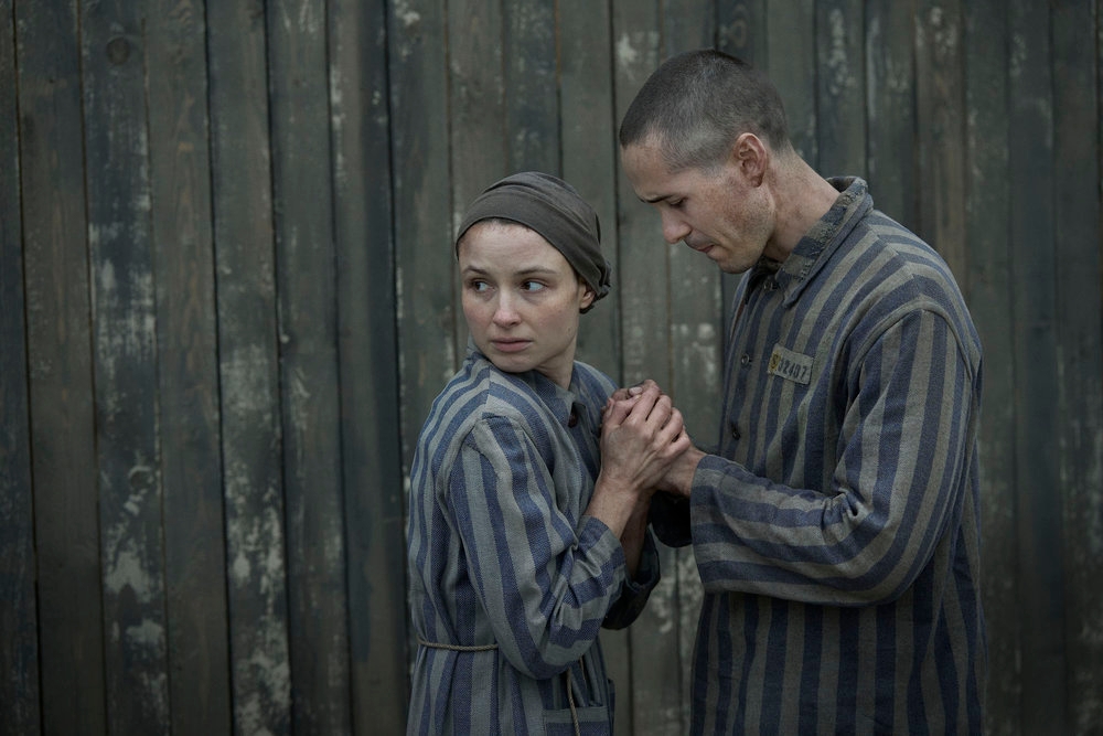 Jonah Hauer-King as Lali Sokolov and Anna Próchniak as Gita Furman embrace in Auschwitz in the first episode of Peacock’s “The Tattooist of Auschwitz.” (Martin Mlaka/Sky UK)