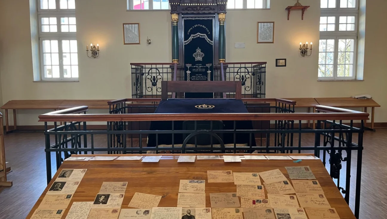 A display of looted postcards inside the former Chachmei Lublin yeshiva.