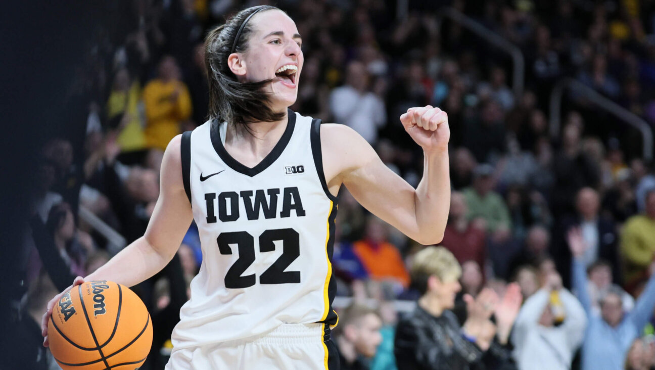 Caitlin Clark of the Iowa Hawkeyes celebrates after beating the LSU Tigers 94-87 in the Elite 8 round of the NCAA Women's Basketball Tournament, April 01, 2024 in Albany, New York. 