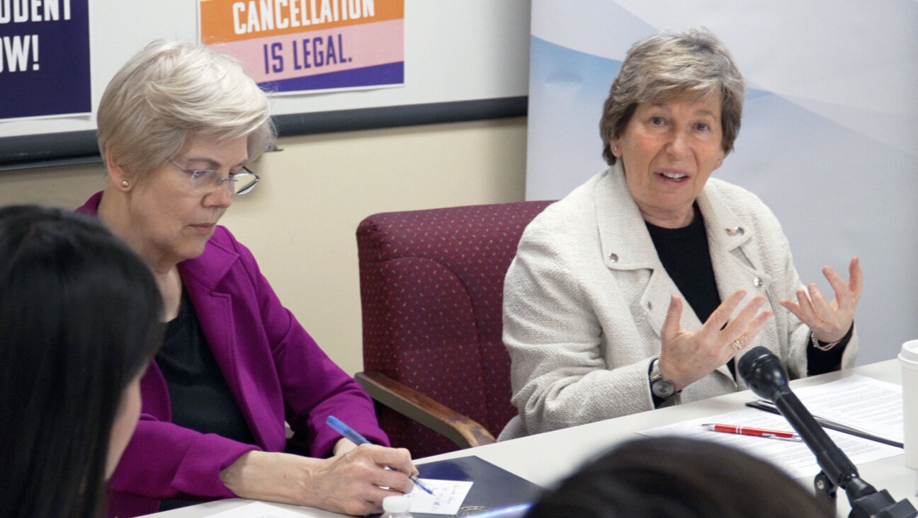 Weingarten, right, with Sen. Elizabeth Warren at a discussion in Boston on March 18 about the student debt crisis. 
