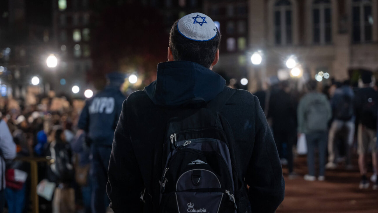 A Jewish student watches a Pro-Palestinian protest on Columbia University's campus, Nov. 14, 2023 in New York City. 