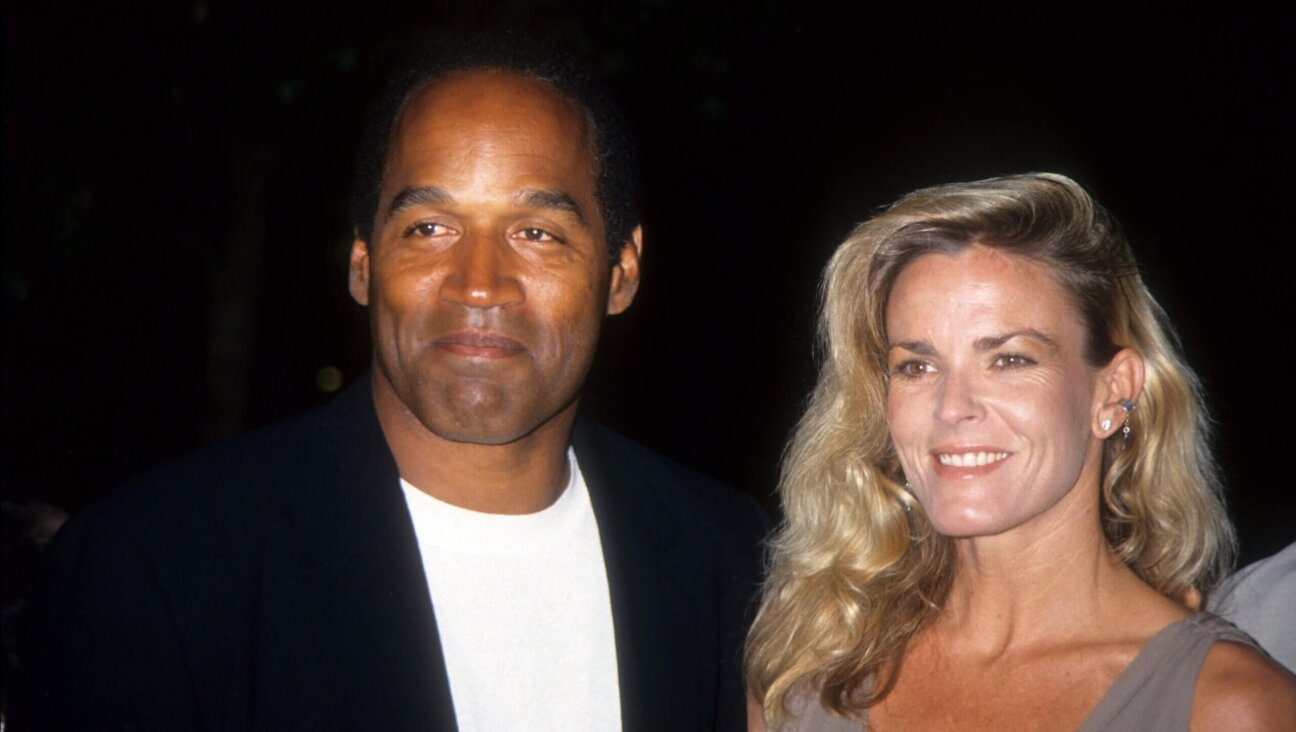 O.J. Simpson and Nicole Brown Simpson pose at the premiere of the "Naked Gun 33 1/3: The Final Insult" in which O.J. starred, March 16, 1994 in Los Angeles.