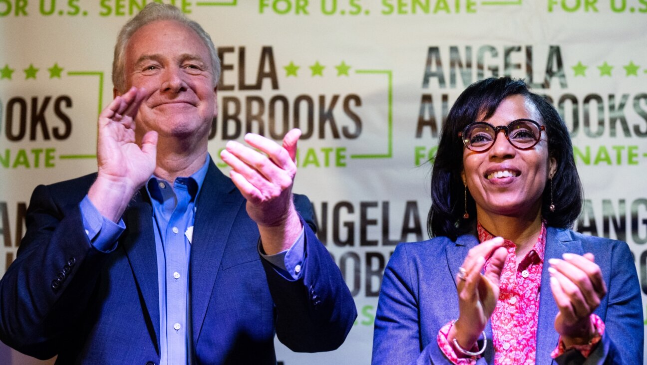 Angela Alsobrooks, a Democrat running for U.S. Senate in Maryland, claps with Maryland Sen. Chris Van Hollen, a Democrat, as local officials speak during her “All in for Angela” campaign event at McGinty’s Public House restaurant in Silver Spring, Maryland, April 24, 2024. (Bill Clark/CQ-Roll Call, Inc via Getty Images)