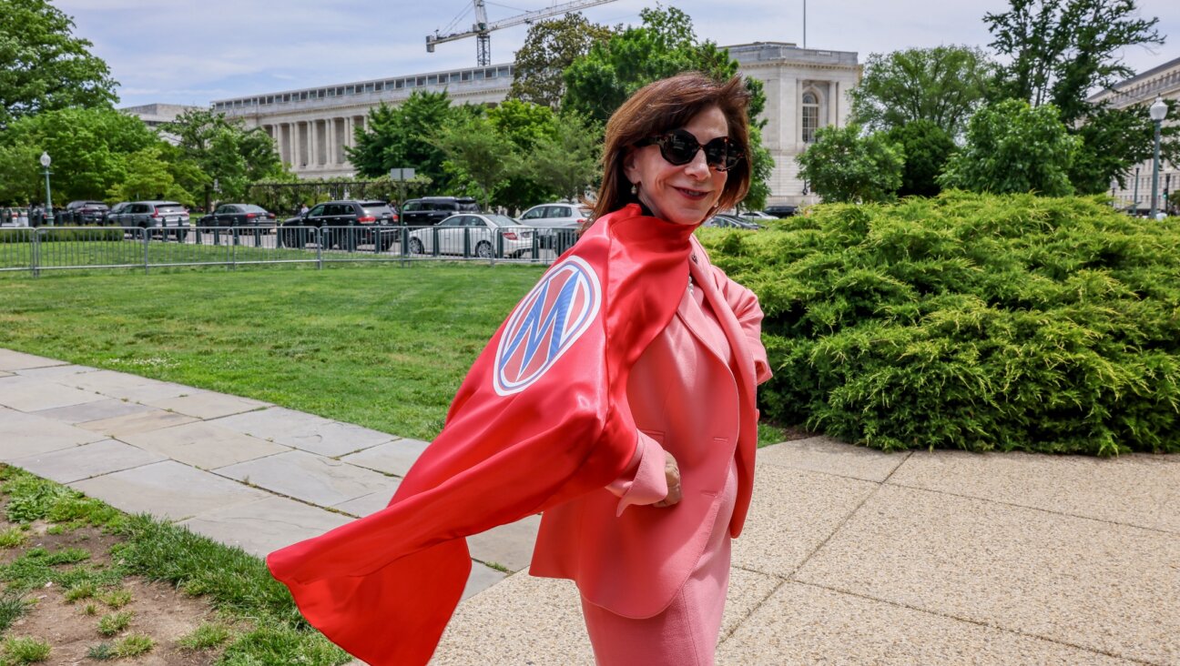Rep. Kathy Manning, a North Carolina Democrat, poses for a photo in her cape given to her by MomsRising at the Mother’s Day Press Conference calling for action on Care and Reproductive rights, at the U.S. Capitol, May 8, 2024. (Jemal Countess/Getty Images for MomsRising)