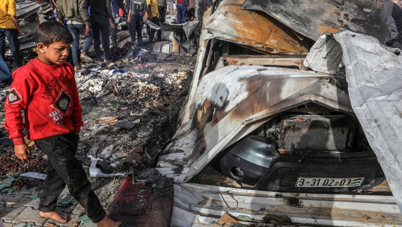 Palestinians inspect damage after an Israeli air strike, in the Al-Mawasi area, west of the city of Rafah in the southern Gaza Strip, May 27, 2024. (Abed Rahim Khatib/Flash90)