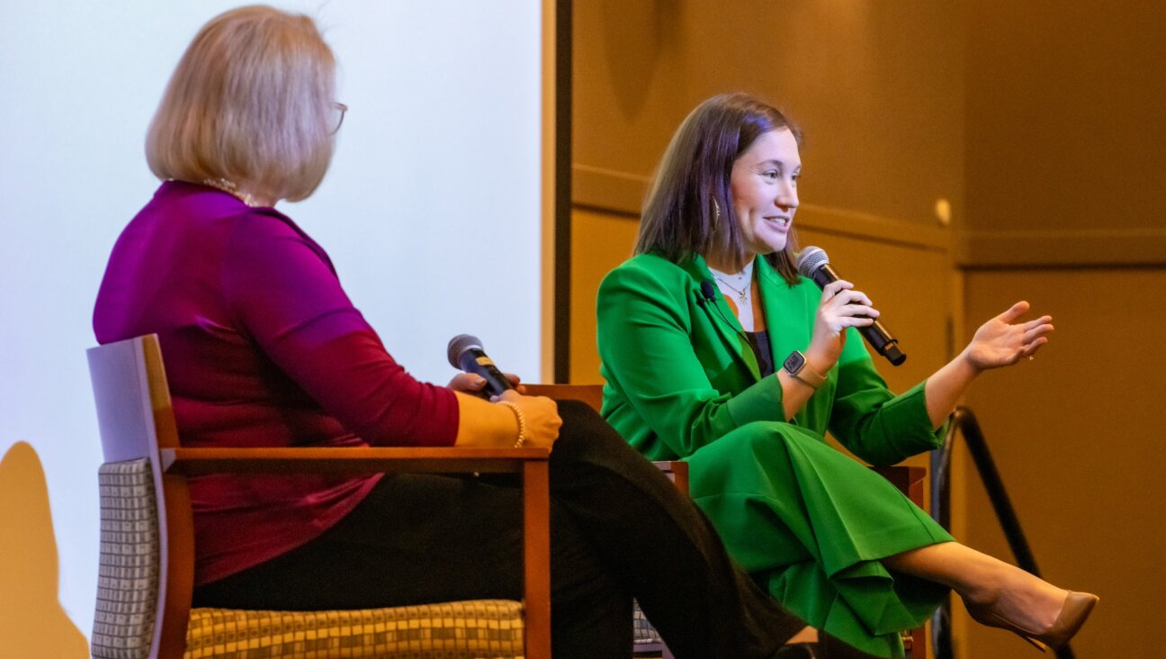 Amy Spitalnick, right, CEO of the Jewish Council for Public Affairs, speaks about antisemitism and democracy at the Samson Family JCC in Milwaukee, Wisconsin, March 19, 2024. Ann Jacobs was the moderator. (Courtesy JCPA)