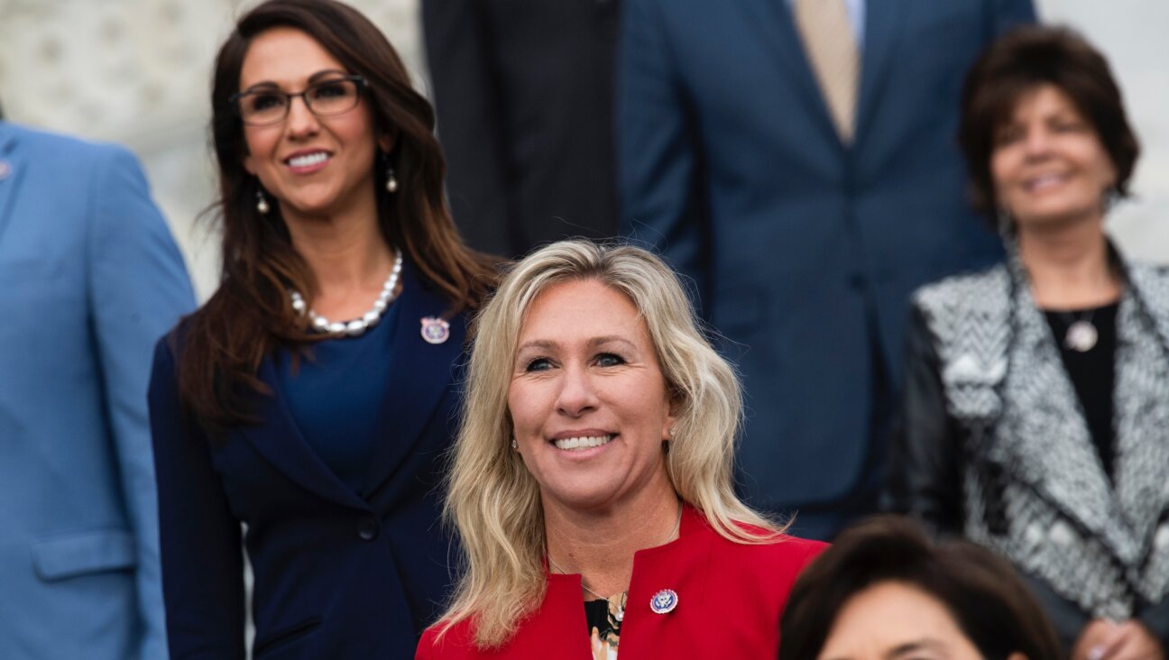 Reps. Marjorie Taylor Greene, center, and Lauren Boebert, left, are seen during a group photo with freshmen members of the House Republican Conference in Washington, D.C., Jan. 4, 2021. (Tom Williams/CQ-Roll Call, Inc via Getty Images)