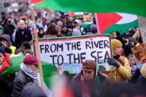 A sign reading “From the river to the sea” can be seen in a pro-Palestinian demonstration in Brussels, Belgium, Jan. 21, 2024 (Thierry Monasse/Getty Images)