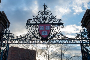 Harvard University’s “Veritas” shield is seen on a gate on Feb. 17, 2024. (PErica Denhoff/Icon Sportswire via Getty Images)