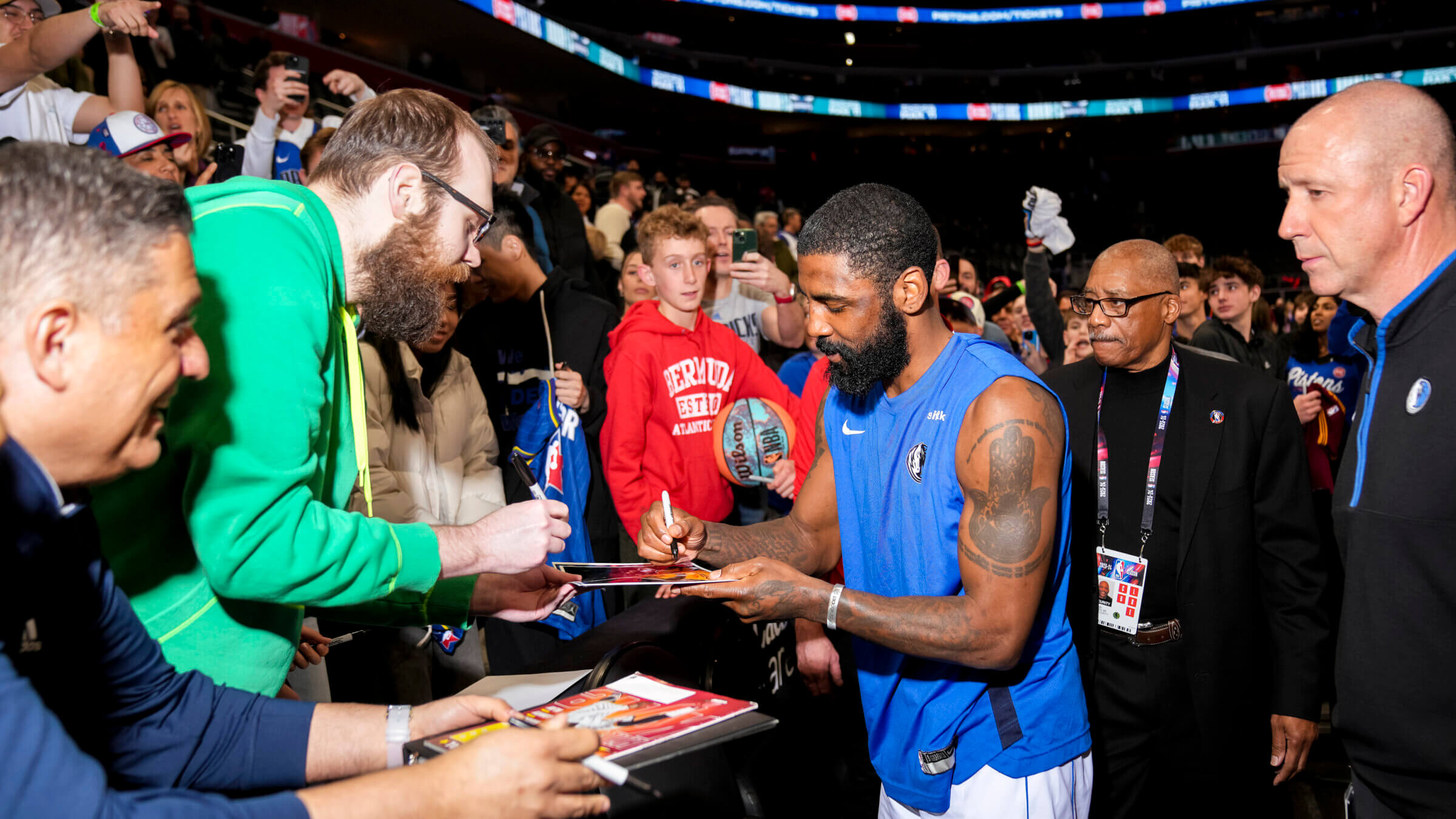 Kyrie Irving signs autographs for fans following a game this spring. The basketball star’s promotion of a documentary that described the Holocaust as a lie seems to have faded from memory.