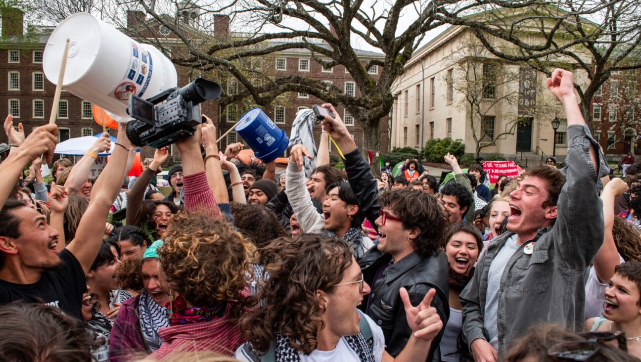 Pro-Palestinian students celebrate reaching a deal with the administration at Brown University, bringing an end to their encampment, in Providence, Rhode Island on April 30, 2024. (Joseph Prezioso / AFP via Getty Images)