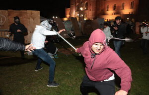 Pro-Palestinian and pro-Israel protesters clash during violence at an encampment at UCLA early in the morning of May 1, 2024. (Wally Skalij/Los Angeles Times via Getty Images)