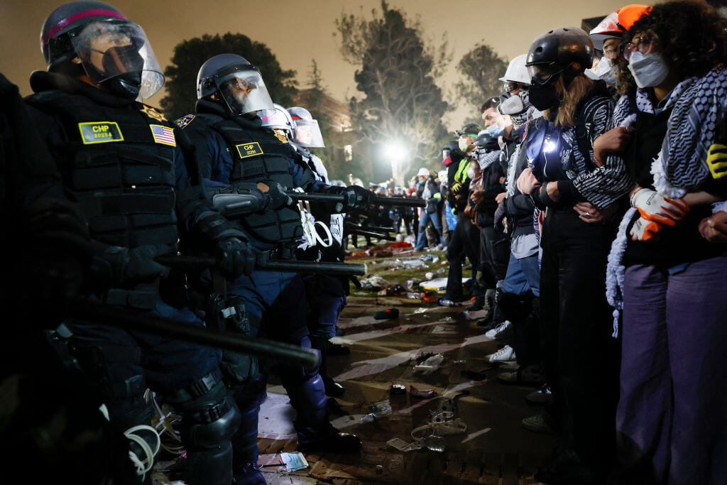 Police face-off with pro-Palestinian students after destroying part of the encampment barricade on the campus of the University of California, Los Angeles (UCLA) on May 2, 2024.