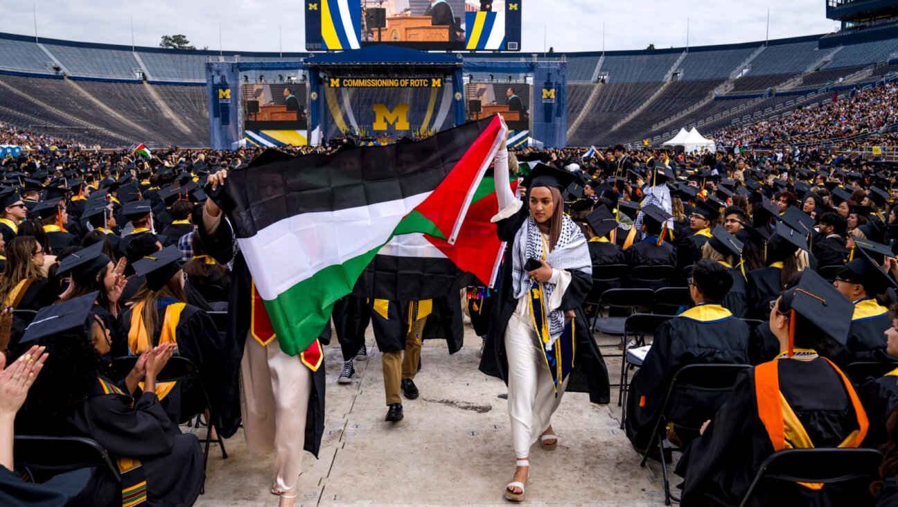 Salma Hamamy carries a Palestinian flag during a pro-Palestinian protest during the University of Michigan’s commencement ceremony on May 4, 2024 at Michigan Stadium in Ann Arbor, Michigan. (Nic Antaya/Getty Images)
